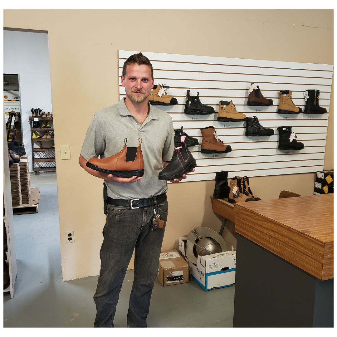 Man holding boots