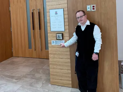 Haldimand staff member standing beside a hidden silver ticket