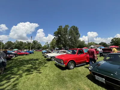 row of vehicles on display at car show