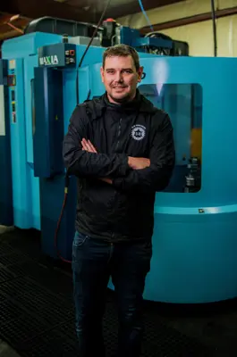 Man standing in front of a machine