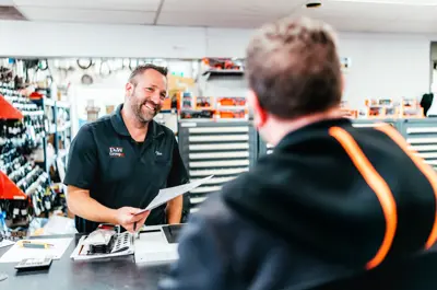 Two men at a sales counter