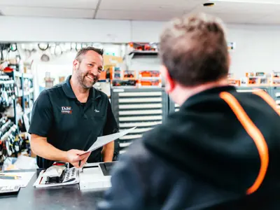 Two men at a sales counter