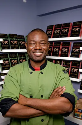 Man standing in front of chocolate bars