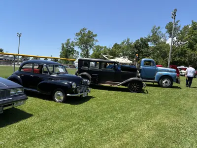 three classic vehicles on display at car show