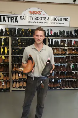 Man holding boots