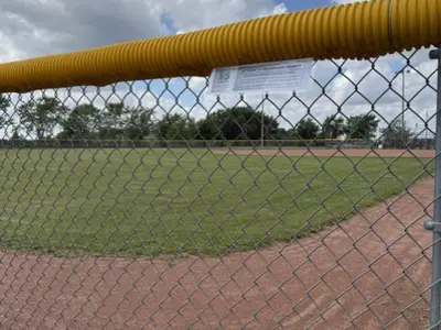 July Silver Ticket Clue: ticket against a fence