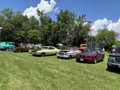 row of cars on display at car show