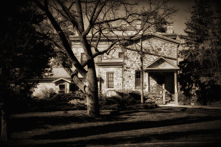 A sepia photo of an old home