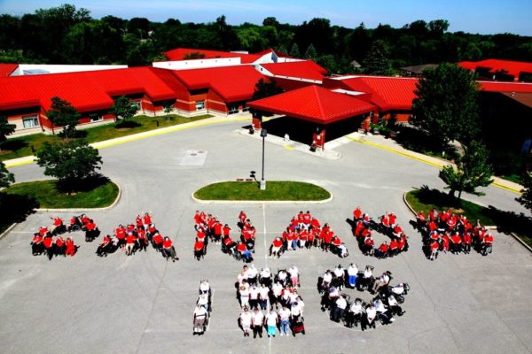 Grandview Lodge Residents and staff creating the words "Canada 150" as a group