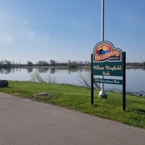 William Wingfield Park Entrance Sign by shoreline
