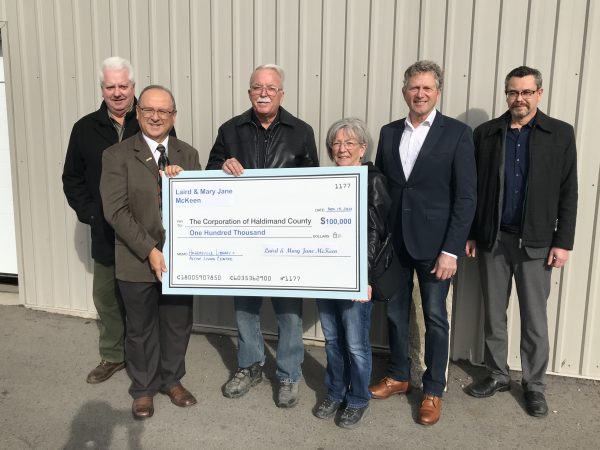 Community members Laird and Mary Jane McKeen present Haldimand Council members and staff with a $100,000 ceremonnial cheque. Stewart Patterson, Haldimand County Ward 1 Councillor Tony Dalimonte, Haldimand County Ward 4 Councillor Laird McKeen Mary Jane McKeen Doug Miller, Fundraising Committee Member Paul Diette, CEO, Haldimand County Public Library.