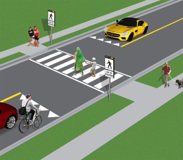 Pedestrians using a pedestrian crossover.